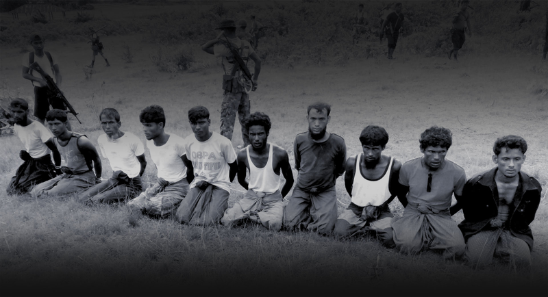 Reuters reported, “This photo was taken on the day the 10 Rohingya men were killed. Paramilitary police officer Aung Min, left, stands guard behind them. The picture was obtained from a Buddhist village elder, and authenticated by witnesses.”